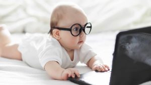 Before image is missing - cute baby with glasses on computer